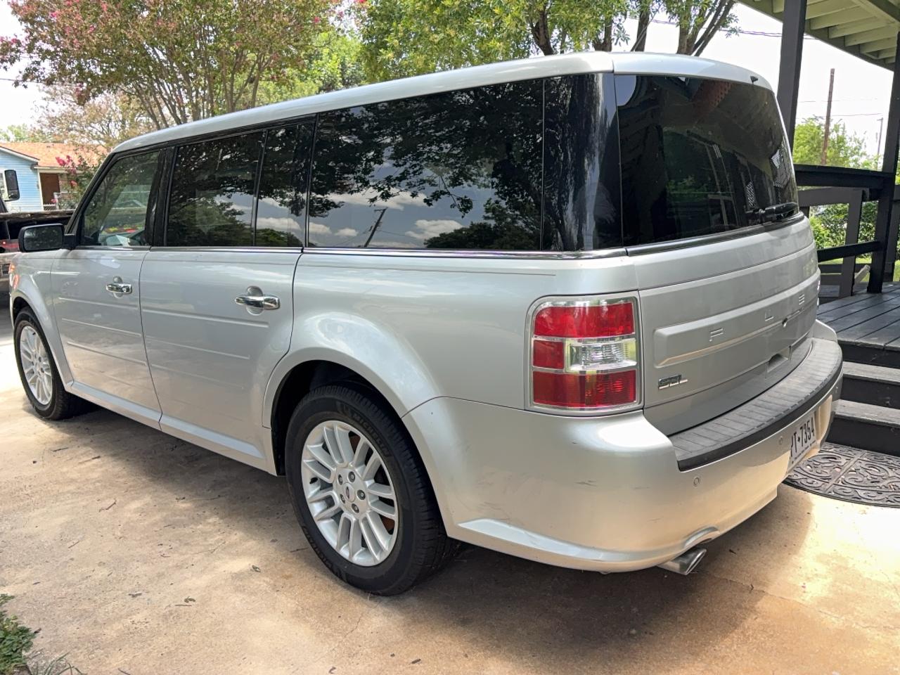 Silver Ford Flex SUV purchased directly from a seller's driveway by California Wrecked Cars